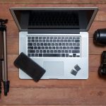 Top,View,Of,Photographer's,Desk,With,Photographic,Equipment,,With,Camera,